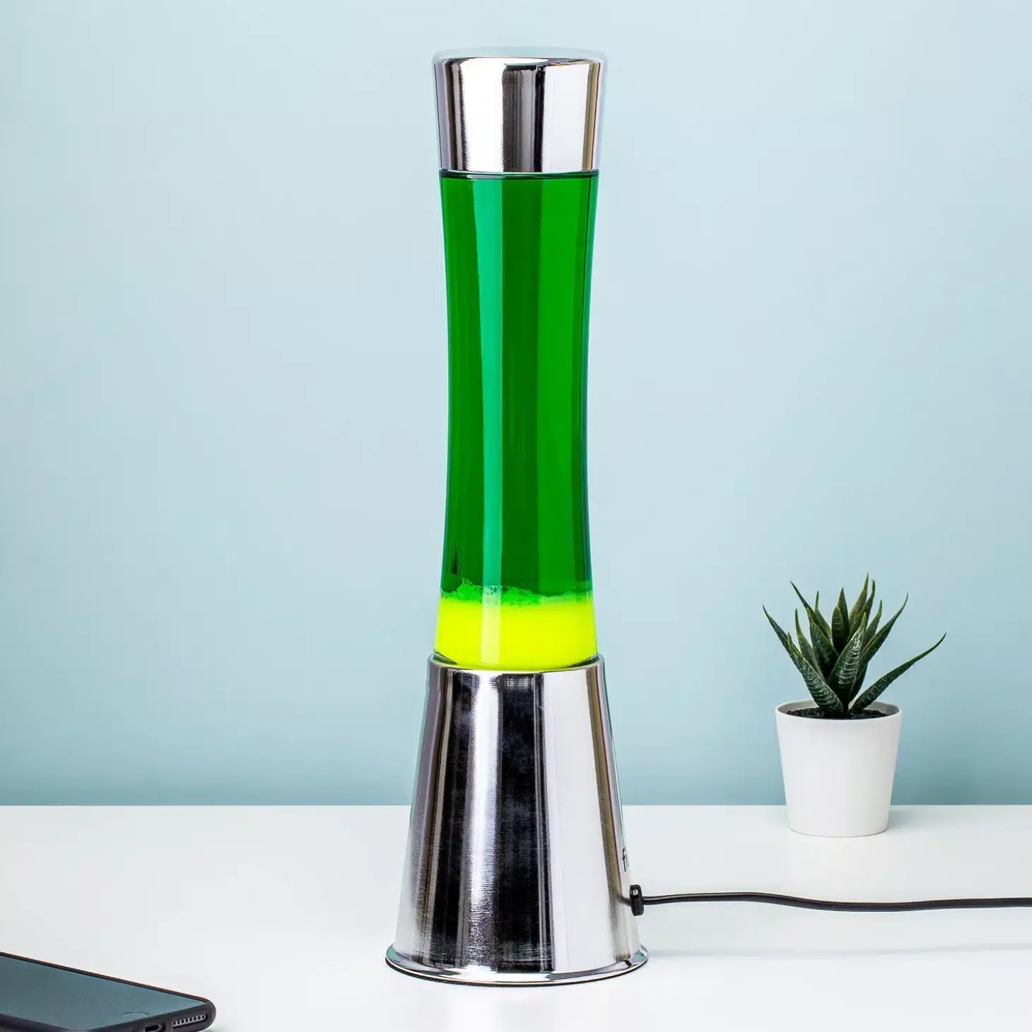 Lavalamp zilver met groene vloeistof en gele lava
