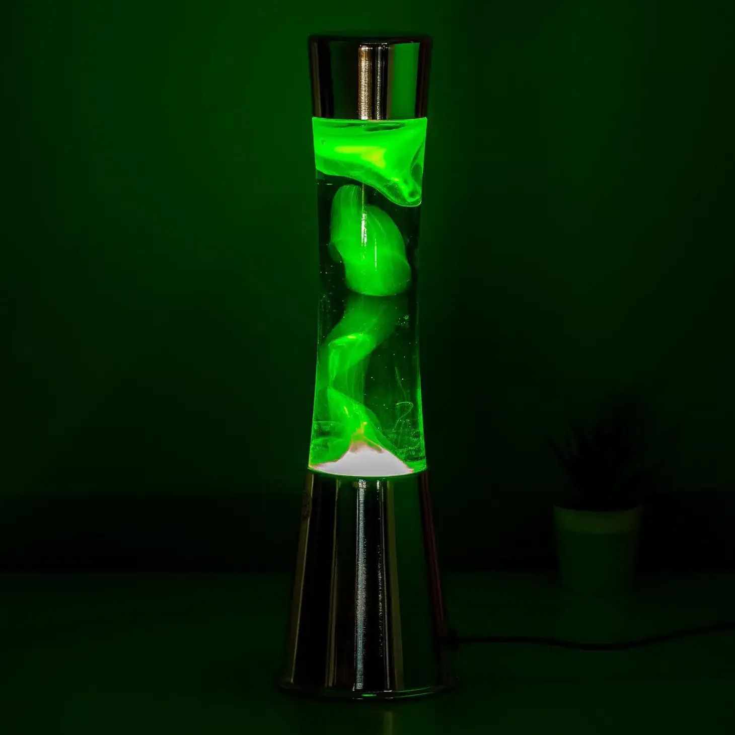 Lavalamp zilver met groene vloeistof en gele lava