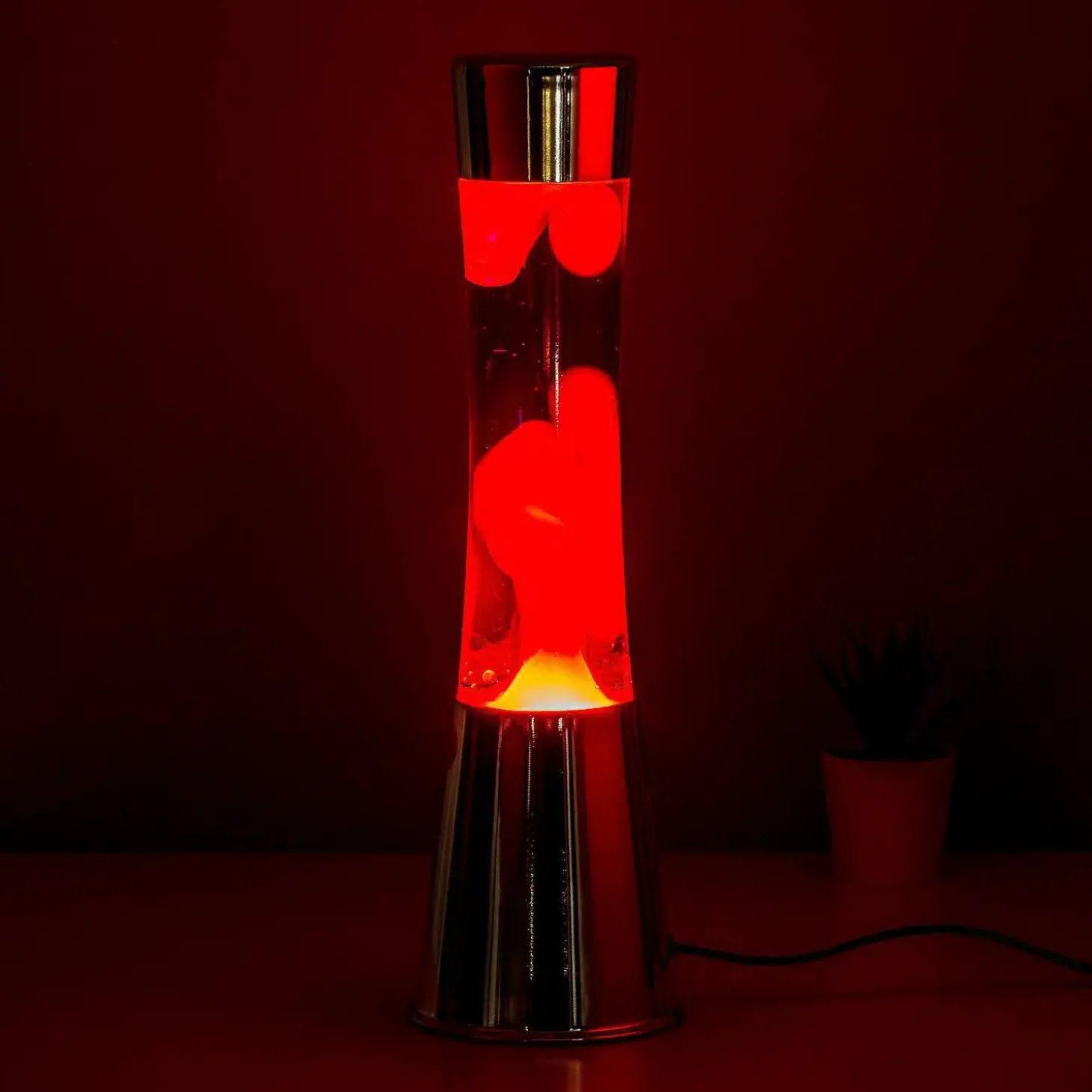 Lavalamp zilver met paarse vloeistof en rode lava